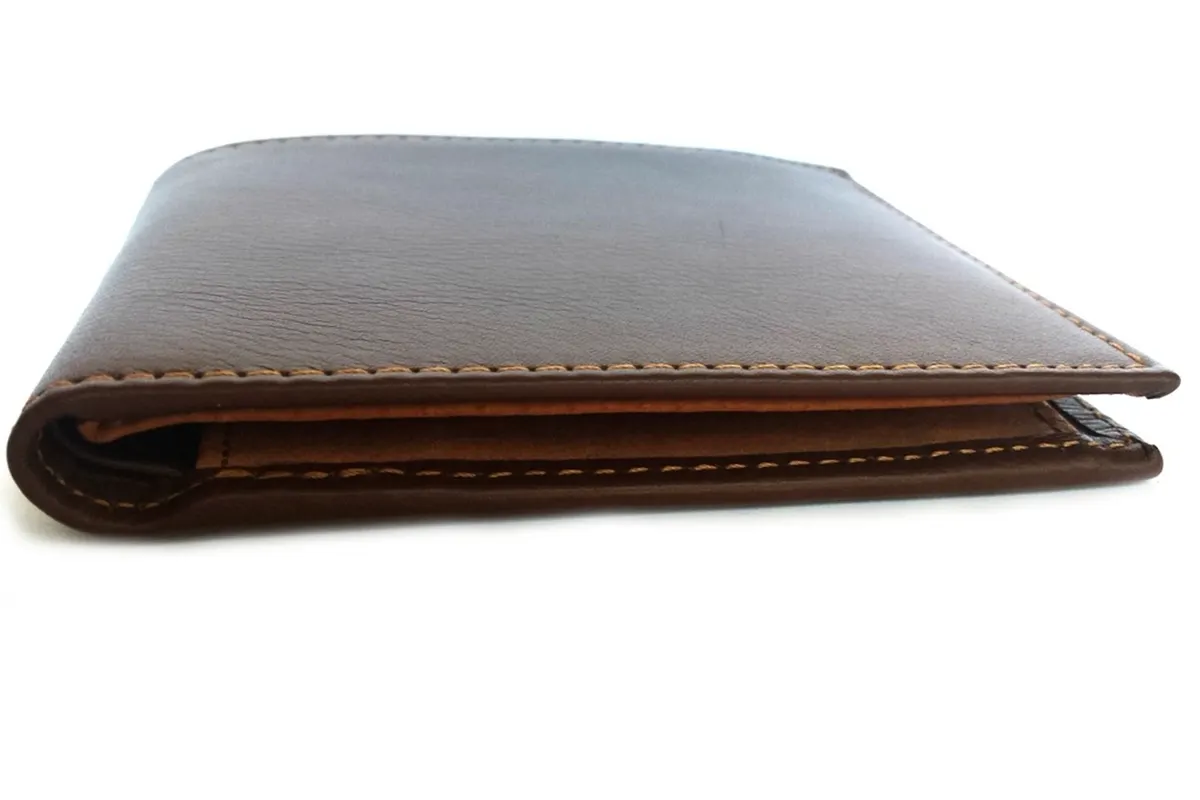 A brown leather bifold wallet with tan contrast stitching, shown from the side on white.